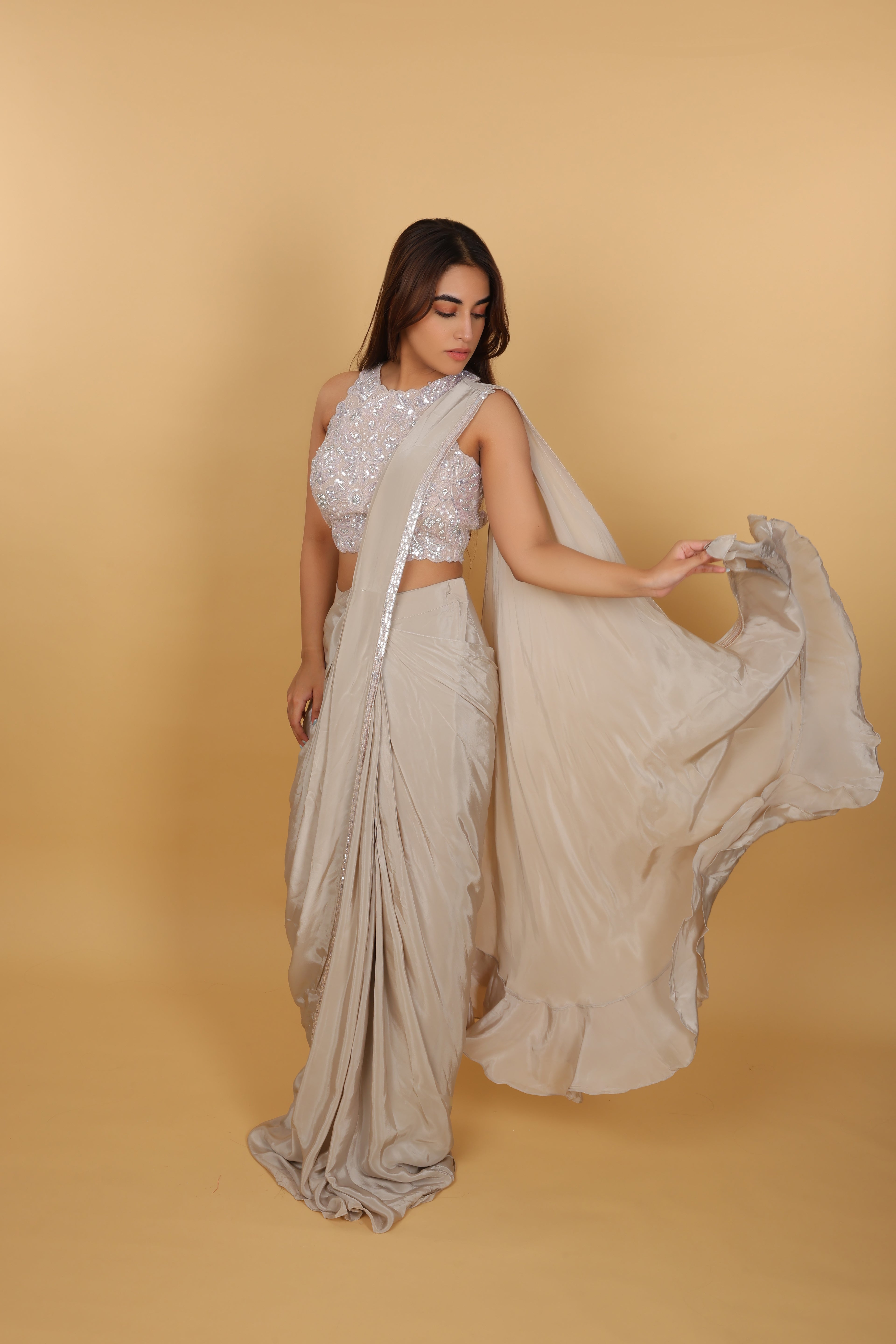 Metallic drape saree with halter-neck blouse