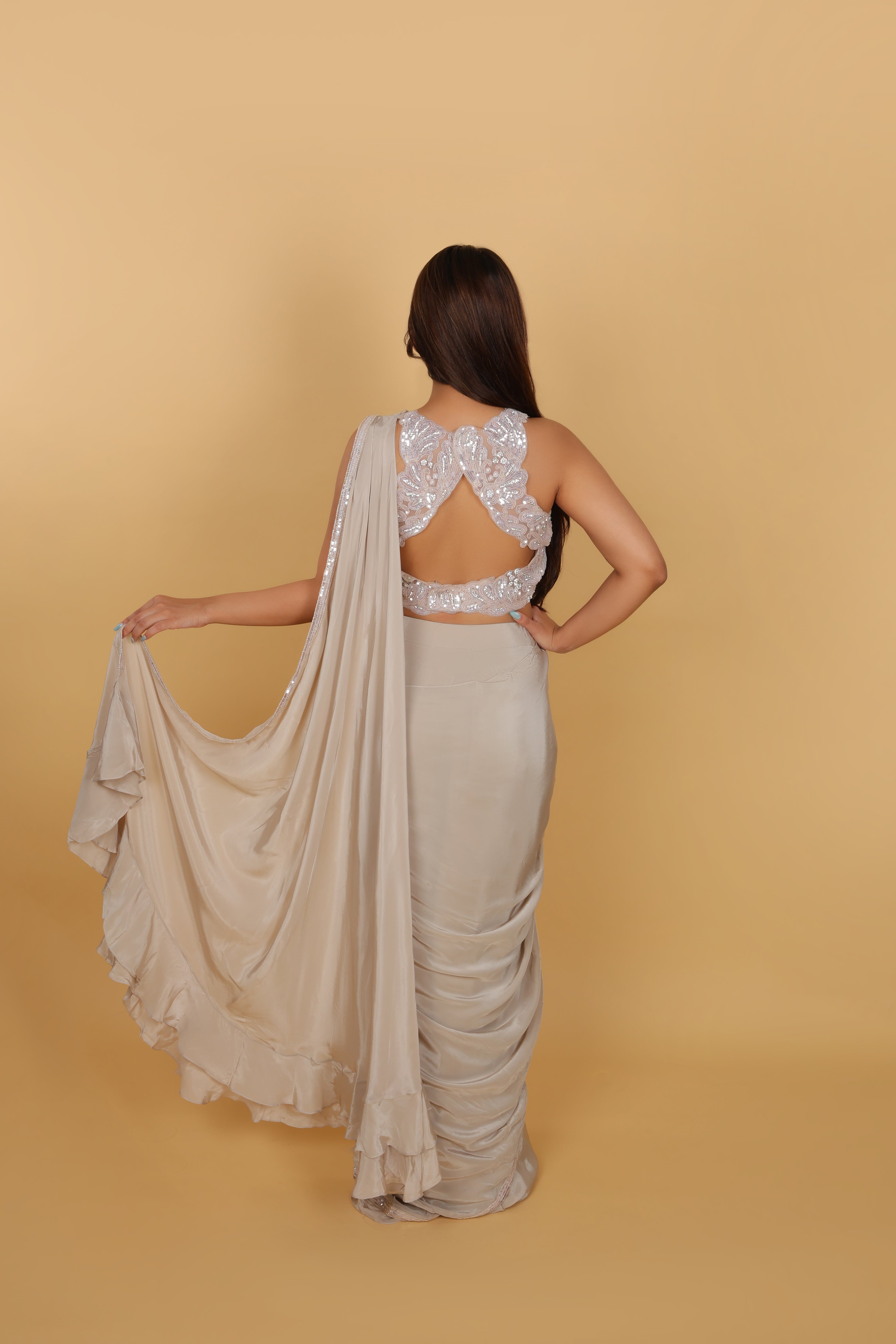 Metallic drape saree with halter-neck blouse