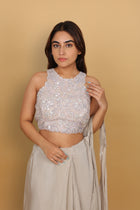 Metallic drape saree with halter-neck blouse