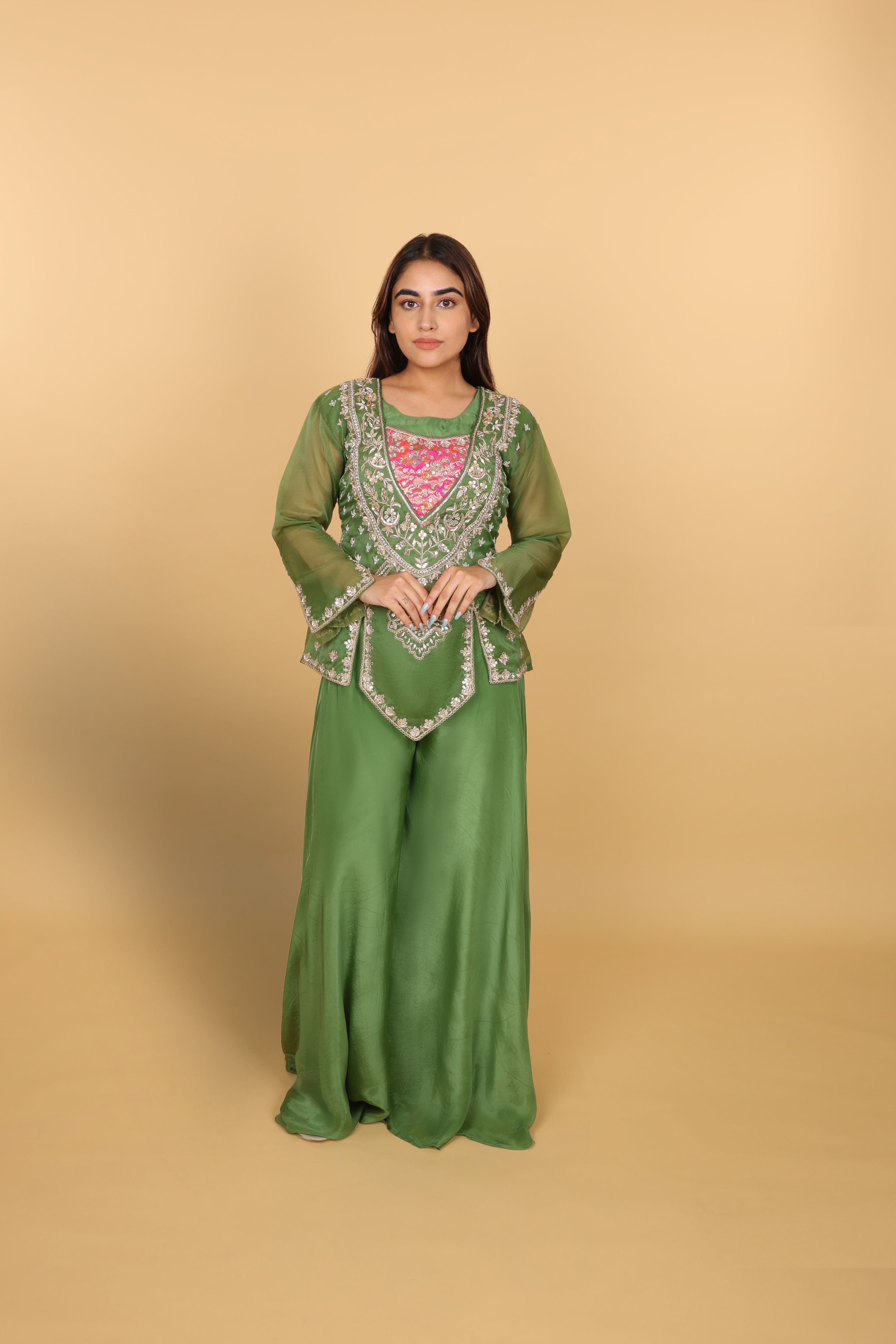 Green peplum top with bustier and umbrella palazzo