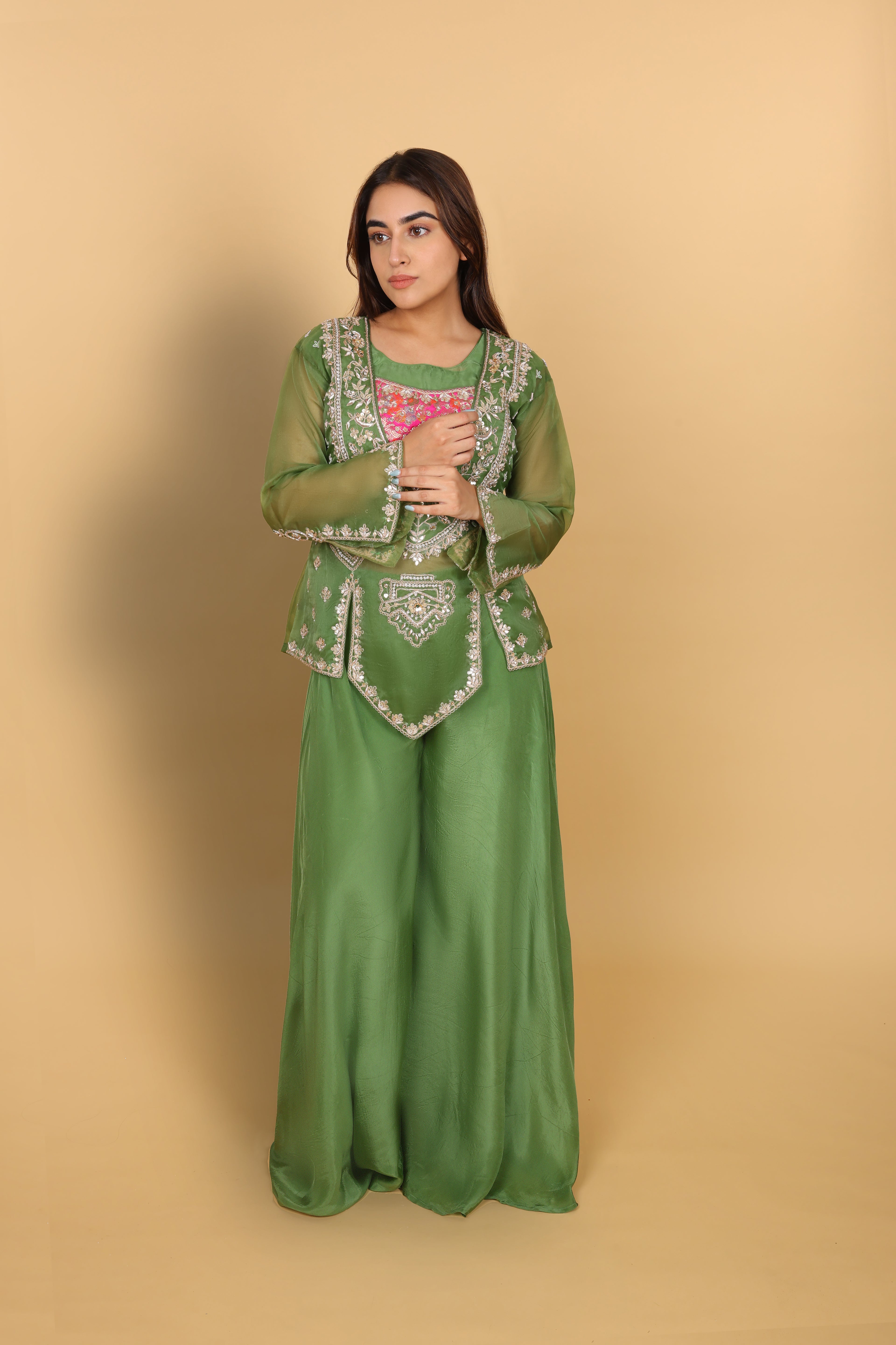 Green peplum top with bustier and umbrella palazzo