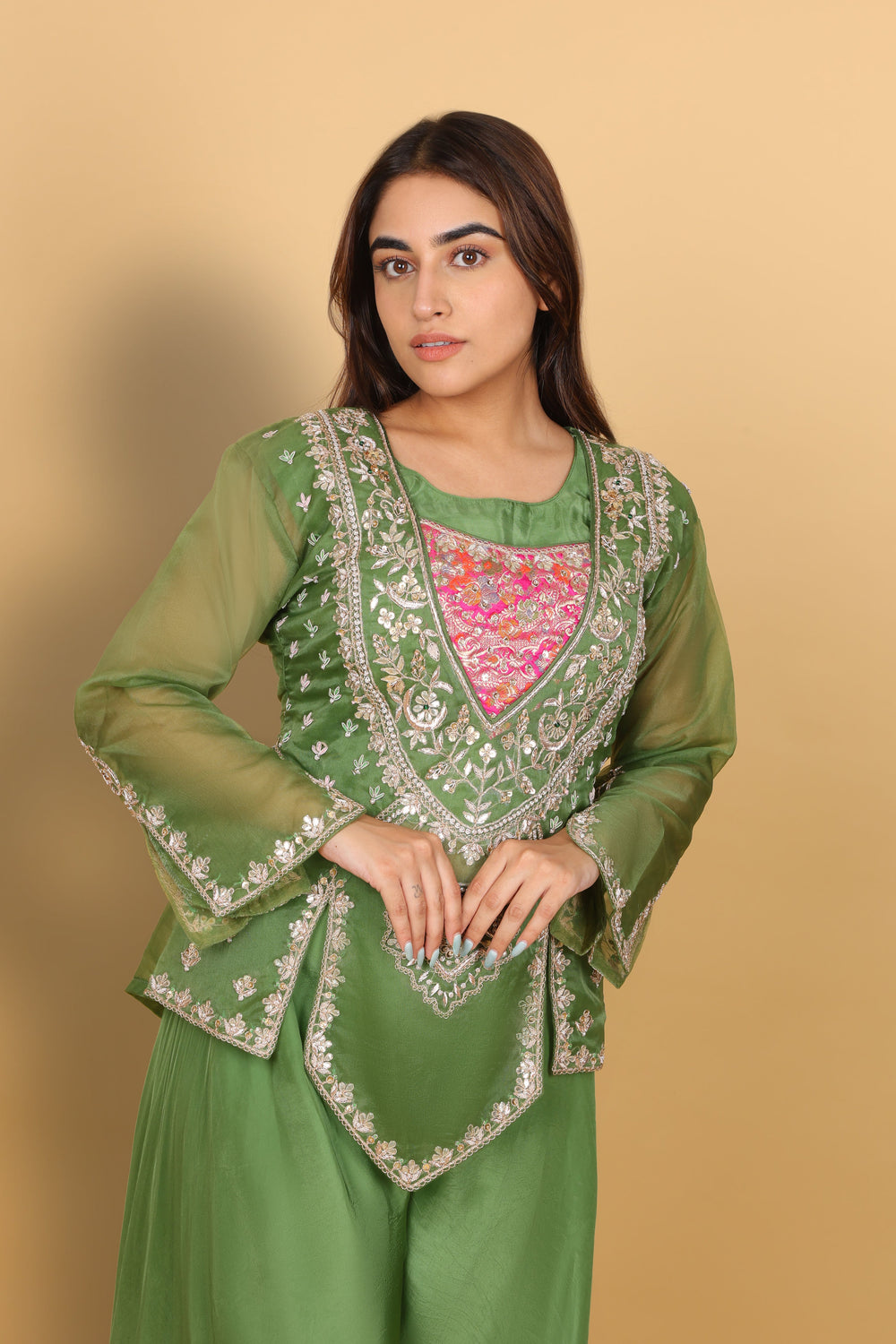 Green peplum top with bustier and umbrella palazzo