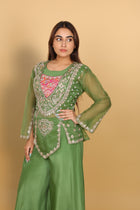 Green peplum top with bustier and umbrella palazzo