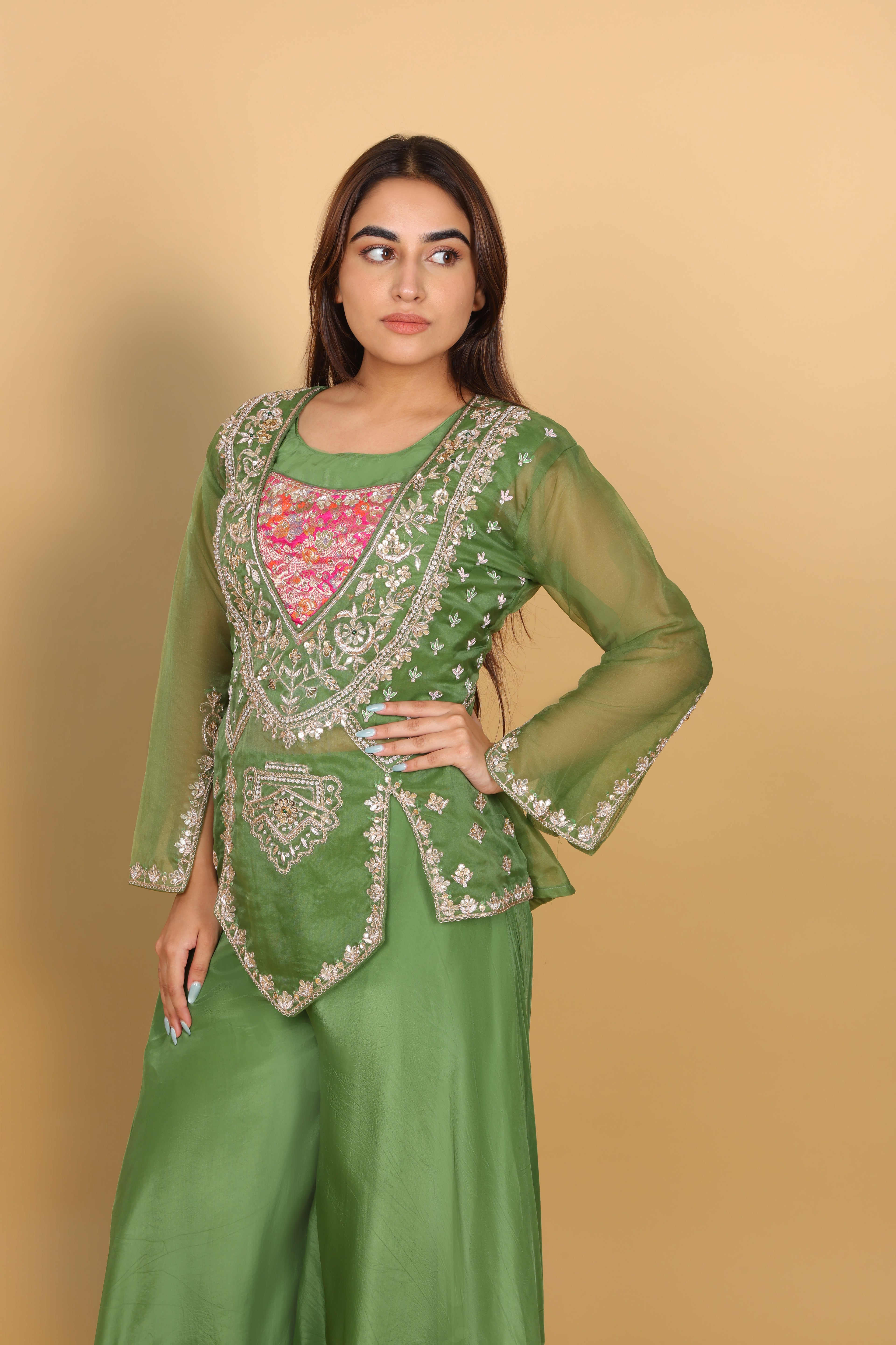 Green peplum top with bustier and umbrella palazzo