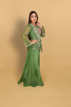 Green peplum top with bustier and umbrella palazzo