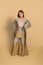 Gold-shaded co-ord set with top and bell-bottom pants