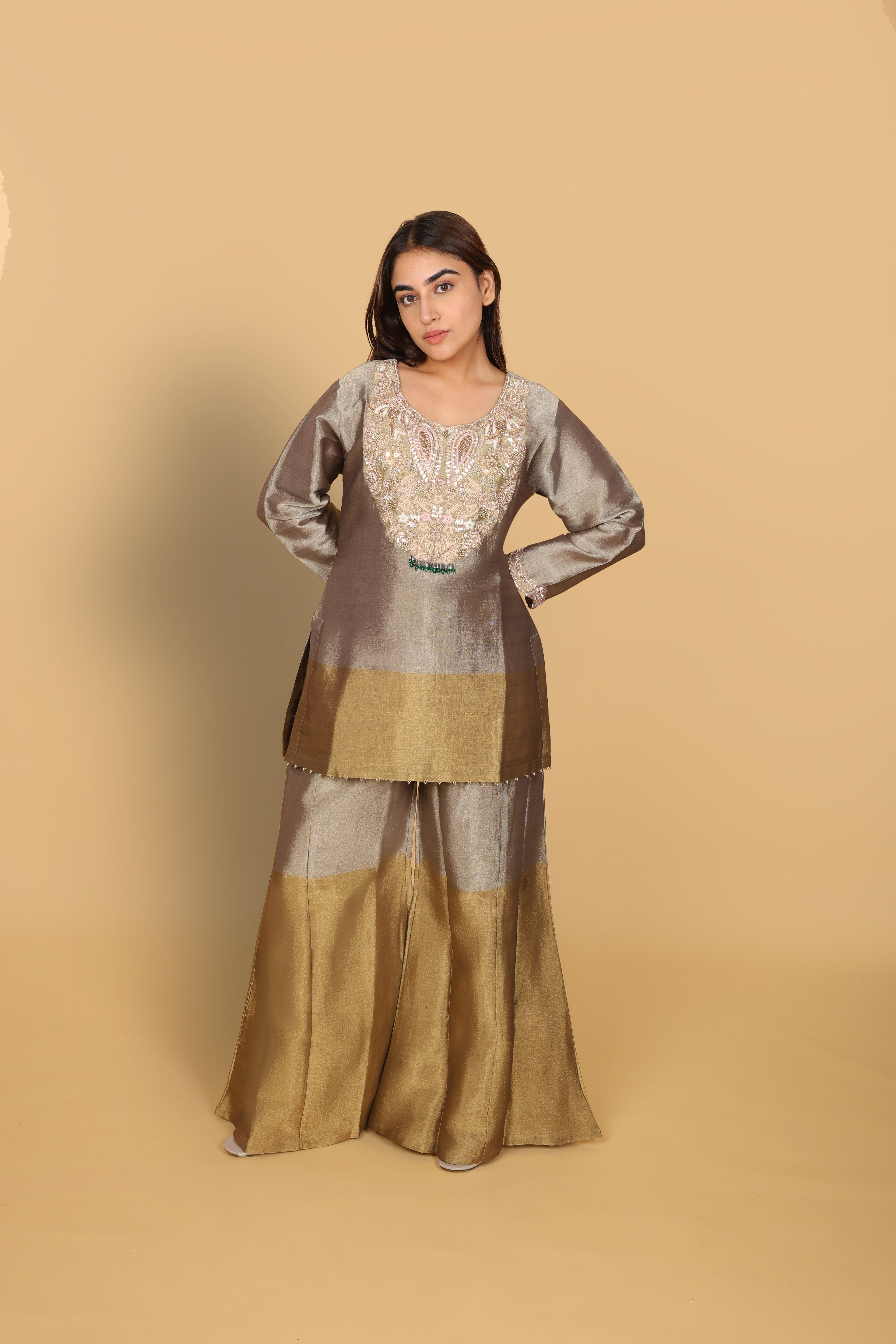 Gold-shaded co-ord set with top and bell-bottom pants