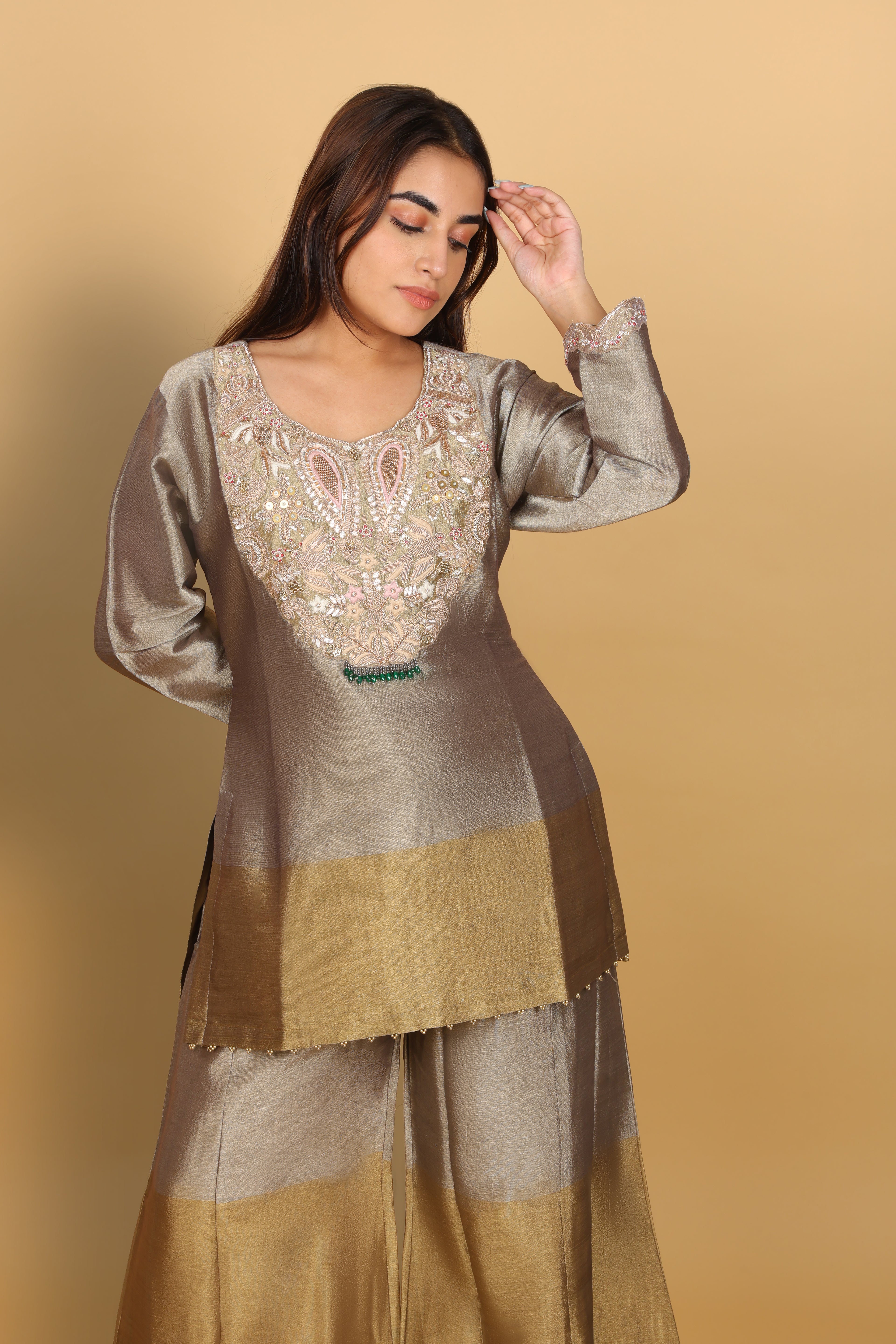 Gold-shaded co-ord set with top and bell-bottom pants