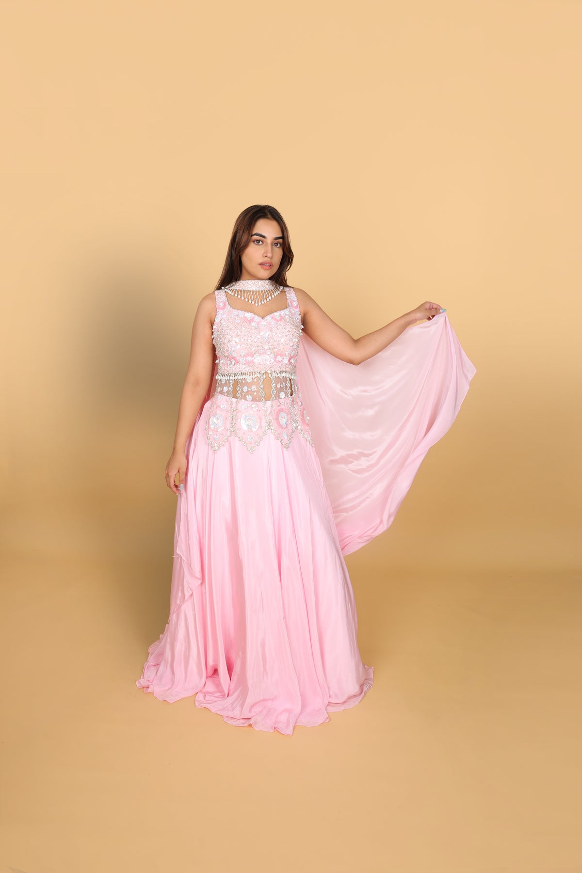Baby-pink Indo-Western lehenga with peplum top and necklace-style dupatta