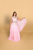 Baby-pink Indo-Western lehenga with peplum top and necklace-style dupatta