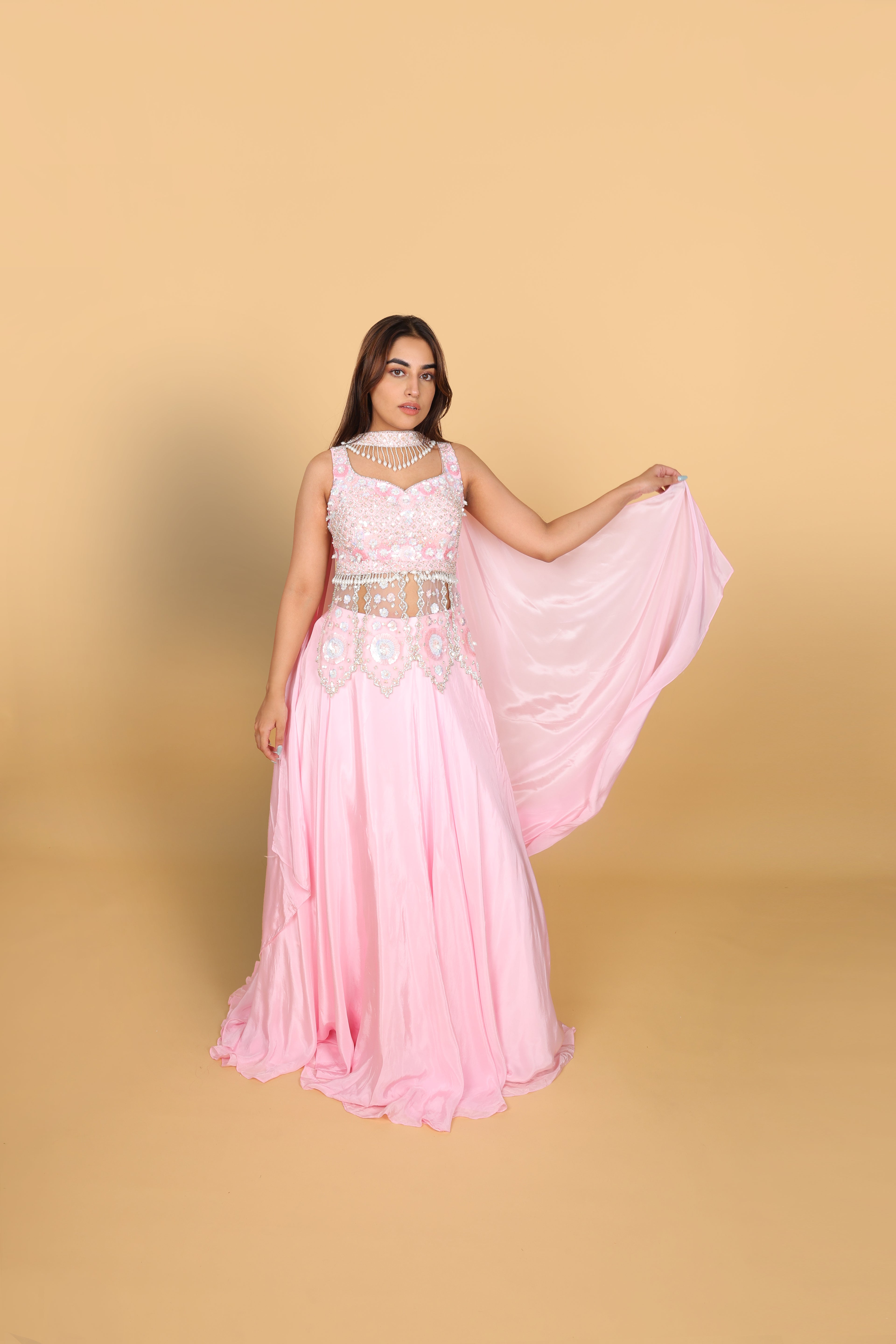 Baby-pink Indo-Western lehenga with peplum top and necklace-style dupatta