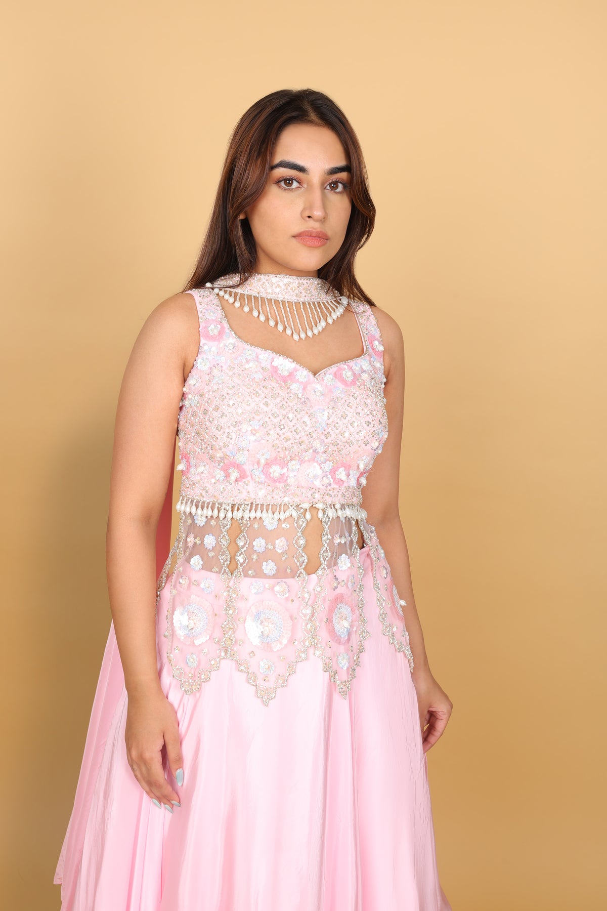 Baby-pink Indo-Western lehenga with peplum top and necklace-style dupatta