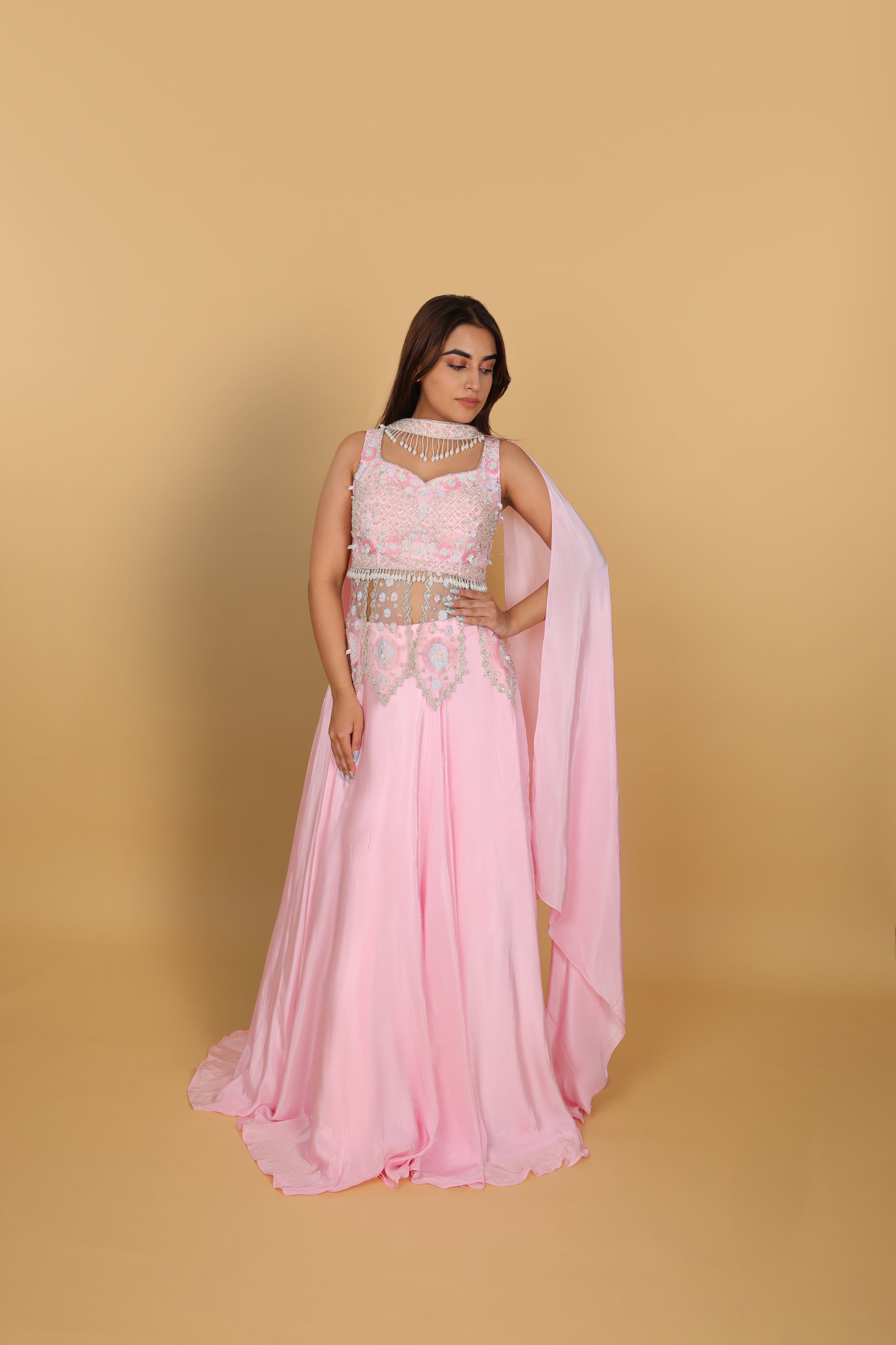 Baby-pink Indo-Western lehenga with peplum top and necklace-style dupatta
