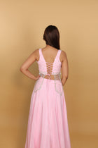 Baby-pink Indo-Western lehenga with peplum top and necklace-style dupatta