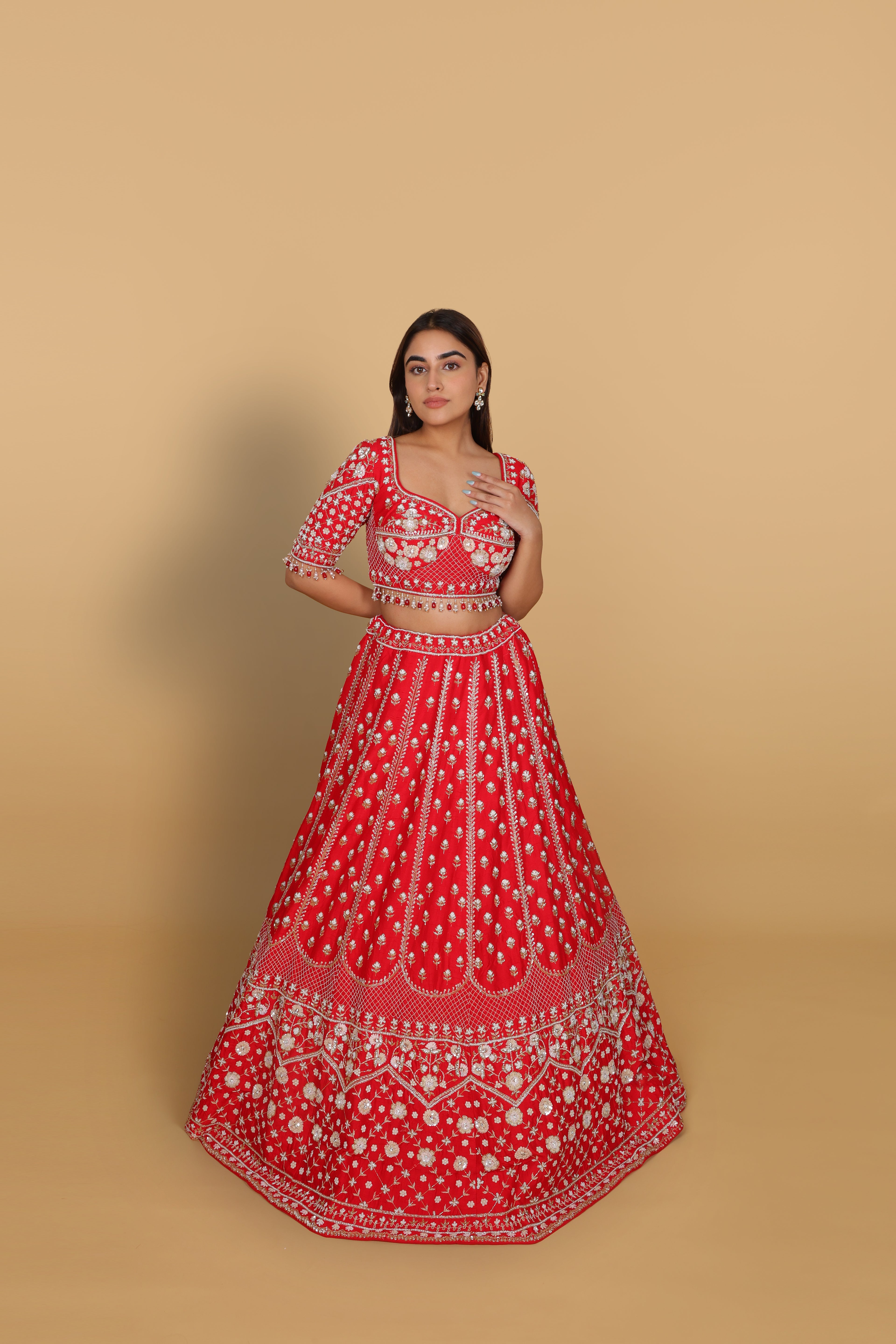Red lehenga Sabyasachi-cut blouse, two dupattas (self and contrast)