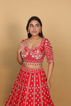 Red lehenga Sabyasachi-cut blouse, two dupattas (self and contrast)
