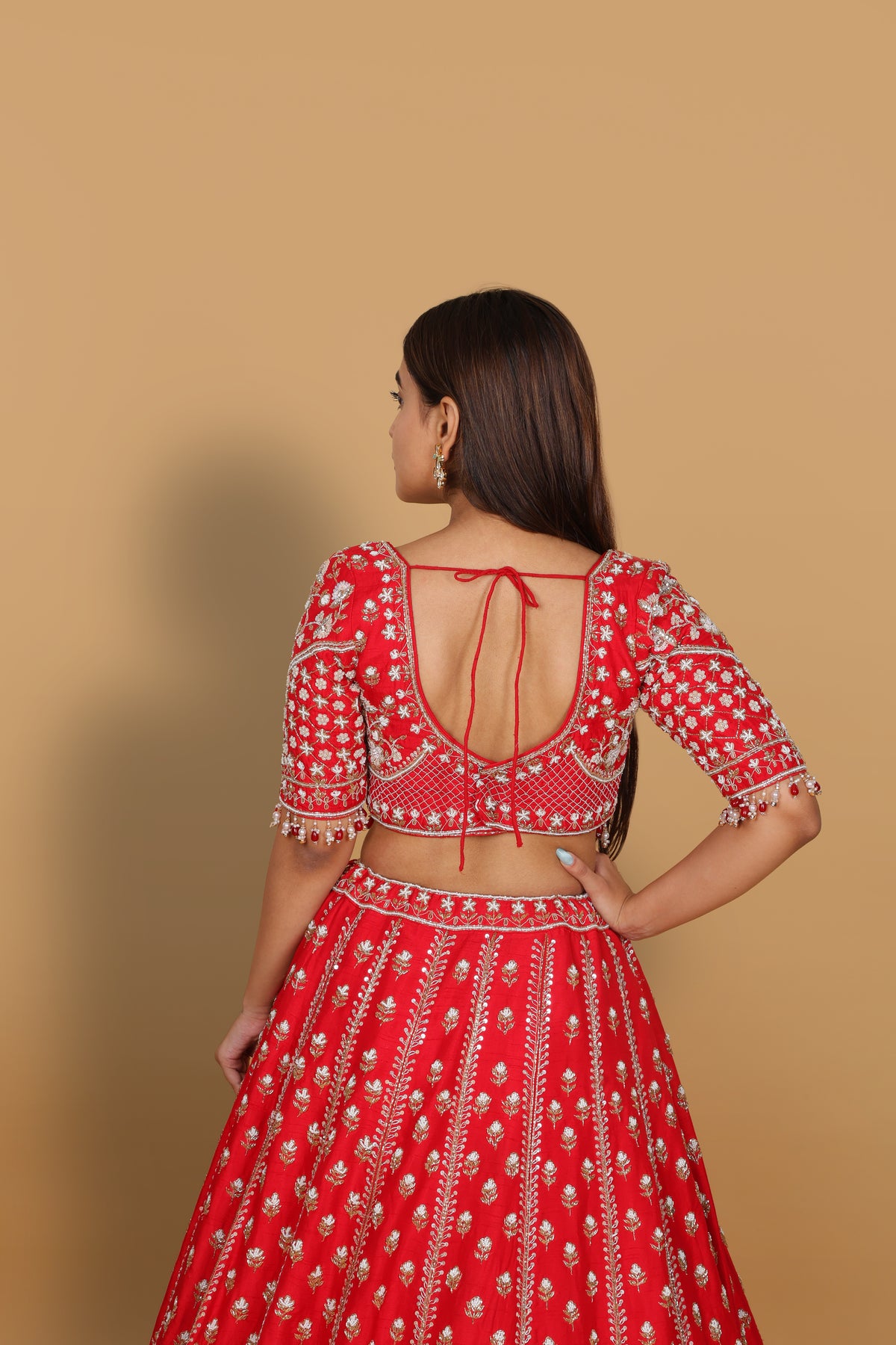 Red lehenga Sabyasachi-cut blouse, two dupattas (self and contrast)