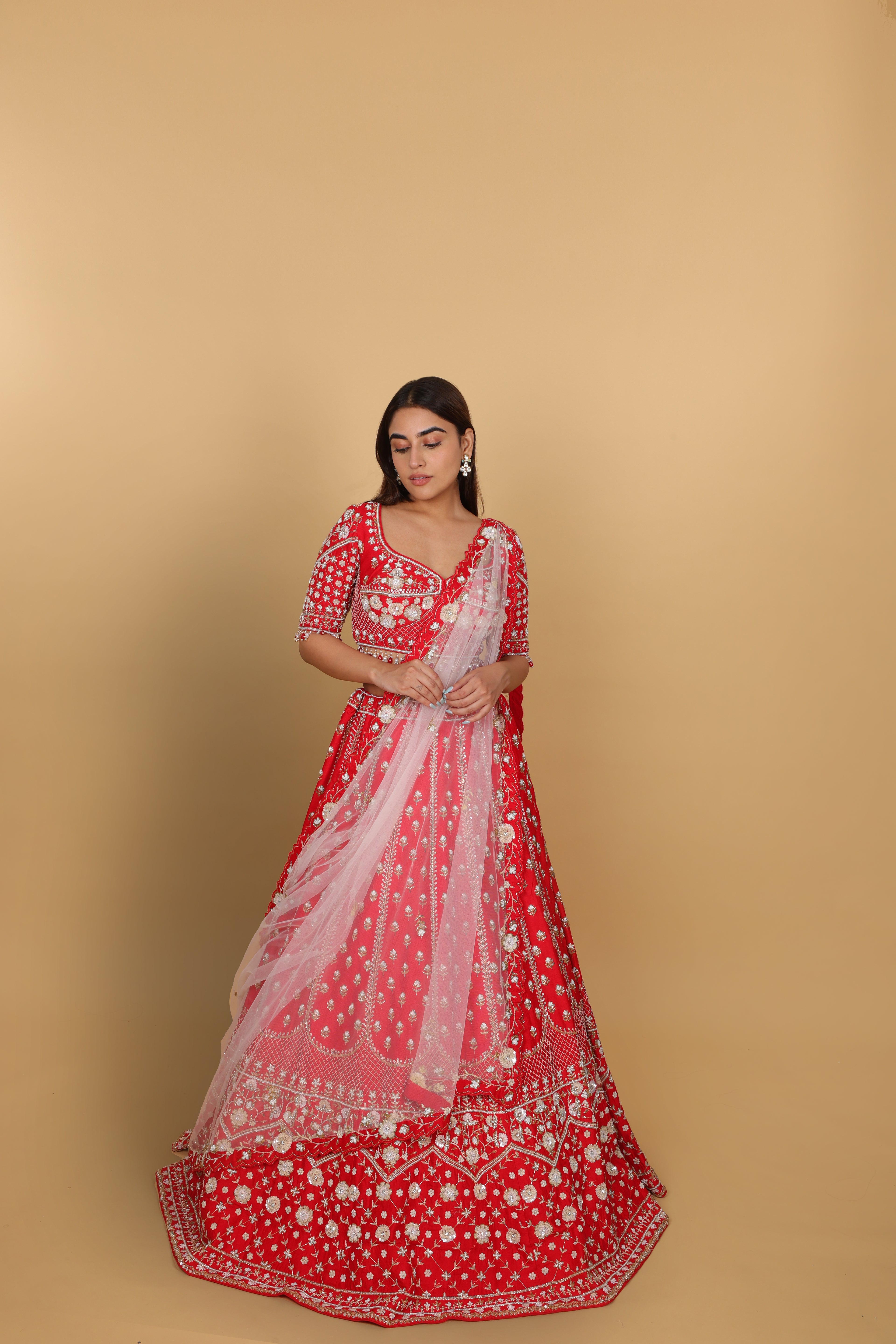 Red lehenga Sabyasachi-cut blouse, two dupattas (self and contrast)